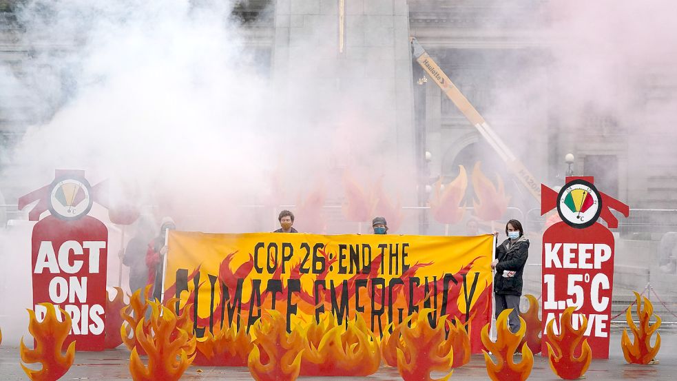 Appellieren an die Politik, konsequenter gegen die Erderwärmung vor zu gehen: Klimaaktivisten vor dem COP26-Gipfel im schottischen Glasgow. Foto: Andrew Milligan/imago images/ZUMA Press