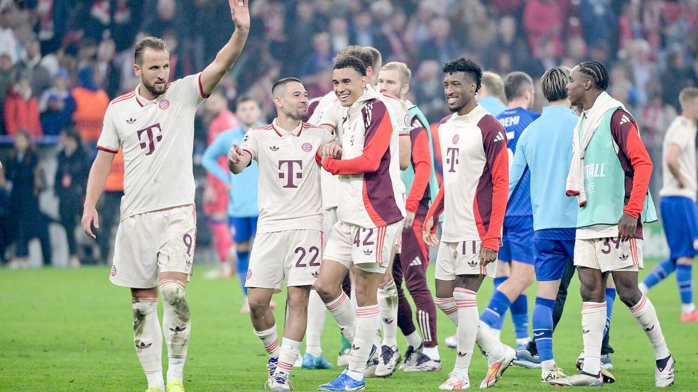 Harry Kane (l) jubelt als Mann des Abends. Foto: Peter Kneffel/dpa