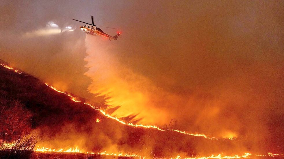 Der Klimawandel ist ein wachsendes Risiko. (Archivbild) Foto: Ethan Swope/AP/dpa